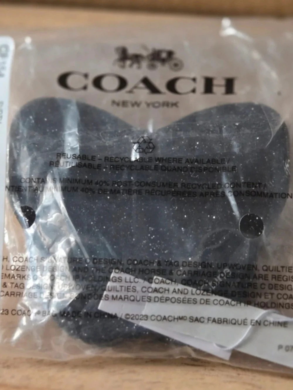 Coach decorative butterfly